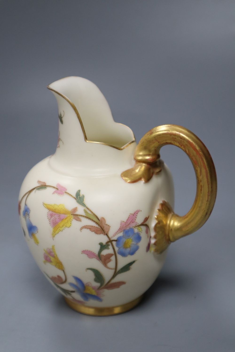 Four small items of Royal Worcester, including a flower-painted vase, No 283, a blush ivory jug, No 1094, a miniature tyg and a mug, ta